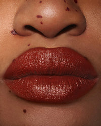ISAMAYA Wild Star Outlaw lipstick applied on lips