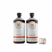 Two bottles of Whisky Mist laundry products on a white background